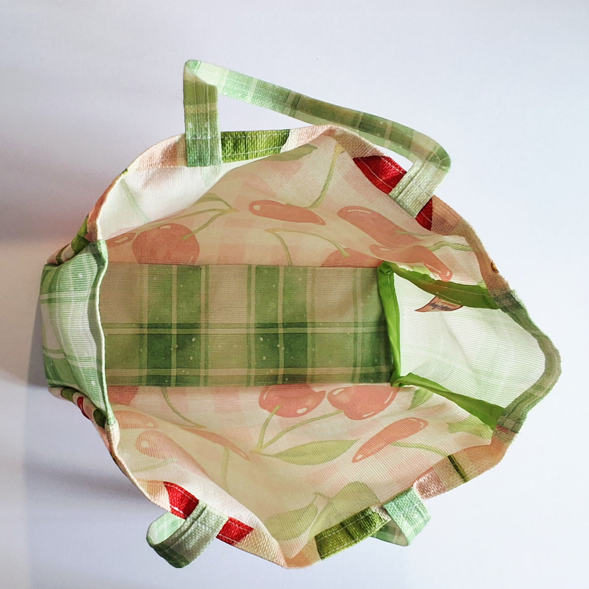 Tote bag, covered in cherries, inside view